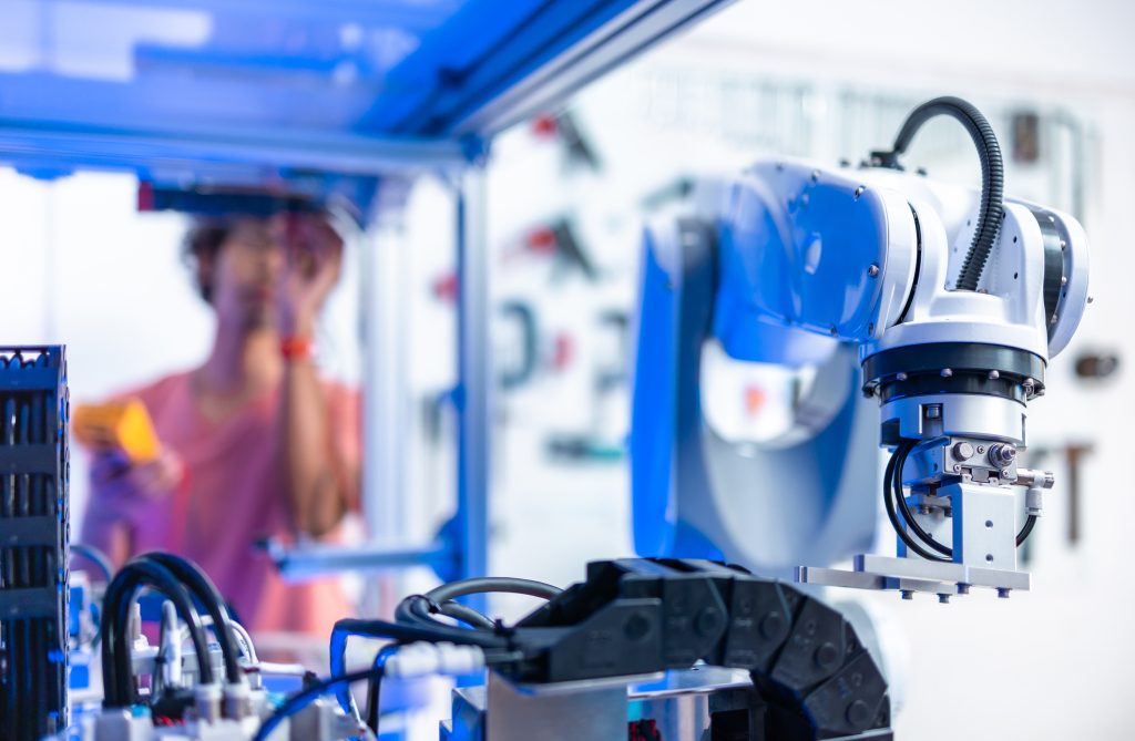 male Engineers Maintenance Robot Arm at Lab. he are in a H