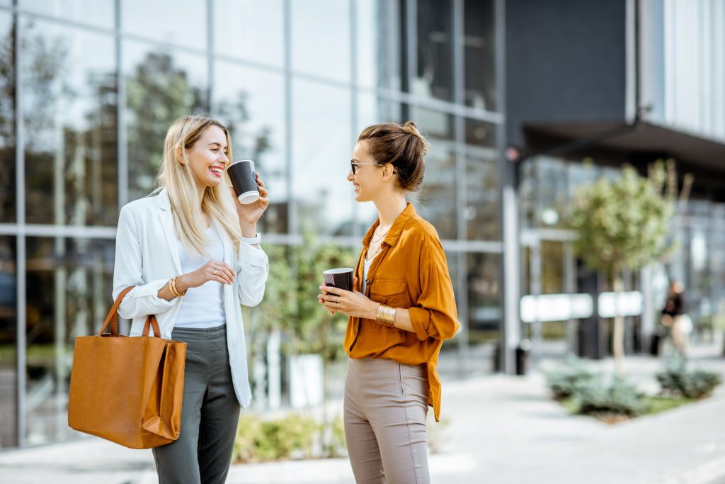Businesswomen talking near the office building