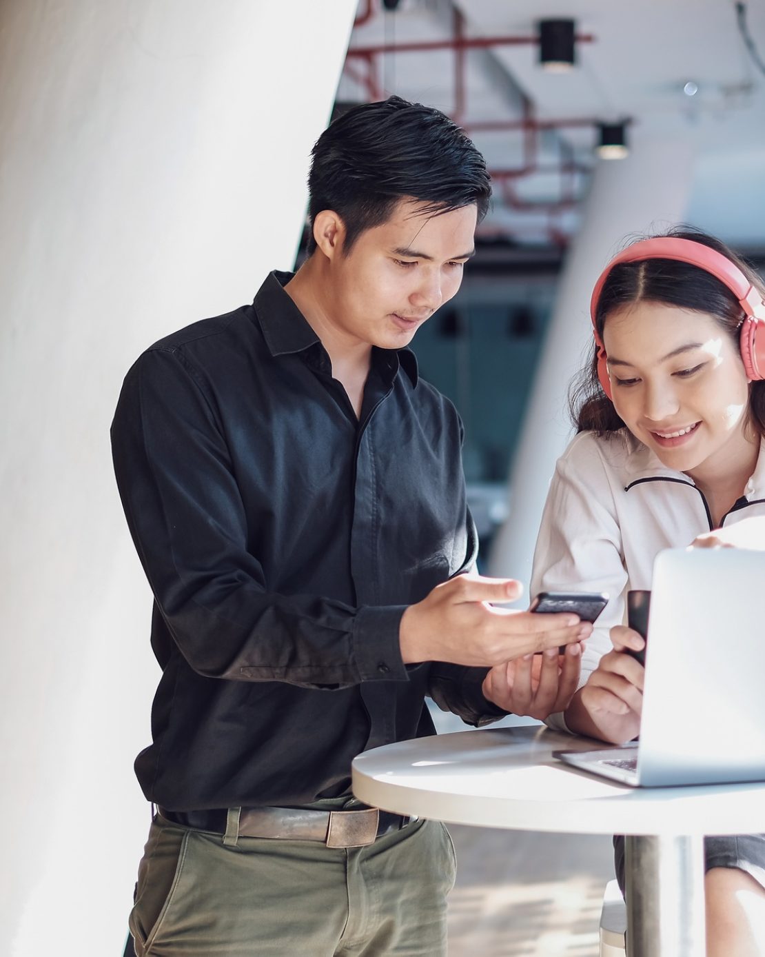 Young asian business people working together on a modern office project.